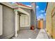 Side exterior with a freshly painted wall, a window, and a wooden gate at 2377 Los Feliz St, Las Vegas, NV 89156