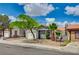 Charming single-story home featuring mature landscaping, a well-maintained lawn, and a two-car garage at 2377 Los Feliz St, Las Vegas, NV 89156