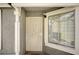 Inviting entryway showcasing a secure white security door and a sidelight window at 2377 Los Feliz St, Las Vegas, NV 89156