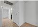 Tiled hallway featuring white walls and doors creating a clean, bright passage at 2377 Los Feliz St, Las Vegas, NV 89156