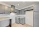 Well-lit kitchen with gray cabinets and neutral countertops, offering a clean and modern feel at 2377 Los Feliz St, Las Vegas, NV 89156