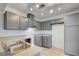 Modern kitchen with stylish gray cabinets, stainless steel sink, and contemporary lighting at 2377 Los Feliz St, Las Vegas, NV 89156