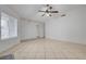 Well-lit living room with tile flooring and ceiling fan; plenty of natural light at 2377 Los Feliz St, Las Vegas, NV 89156