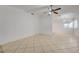 Bright living room featuring tile flooring and a ceiling fan with integrated lighting at 2377 Los Feliz St, Las Vegas, NV 89156
