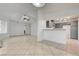 Open concept living space with tile flooring that connects the living room and kitchen at 2377 Los Feliz St, Las Vegas, NV 89156