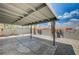 Covered patio in a backyard with block wall and gravel landscaping at 2377 Los Feliz St, Las Vegas, NV 89156