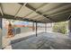 Covered patio in a backyard with gravel landscaping and block wall at 2377 Los Feliz St, Las Vegas, NV 89156