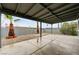 The covered patio overlooks a stone landscaped backyard at 2377 Los Feliz St, Las Vegas, NV 89156