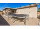 A backyard featuring a trampoline in the foreground and covered patio space at 250 Aspen Bay Ln, Henderson, NV 89012
