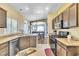 Well-appointed kitchen with granite counters, modern appliances, and an open view into the dining area at 250 Aspen Bay Ln, Henderson, NV 89012