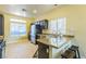 Modern kitchen featuring stainless steel appliances, granite countertops, and bright natural lighting at 250 Aspen Bay Ln, Henderson, NV 89012