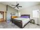 Comfortable main bedroom with a large bed, ceiling fan, and dresser at 250 Aspen Bay Ln, Henderson, NV 89012