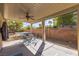 A covered patio with an outdoor dining area and backyard views at 250 Aspen Bay Ln, Henderson, NV 89012