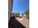 Large backyard featuring desert landscaping, block fence and a secluded hot tub at 2539 Early Light Dr, Las Vegas, NV 89142