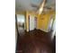 Bedroom featuring hardwood floors, light yellow walls, ceiling fan, and closet at 2539 Early Light Dr, Las Vegas, NV 89142