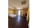 Spacious bedroom with hardwood floors, ceiling fan, and balcony access at 2539 Early Light Dr, Las Vegas, NV 89142