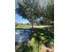 Community park featuring grass, mature trees, playground equipment, and picnic table at 2539 Early Light Dr, Las Vegas, NV 89142