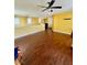 Bright, open floor plan with hardwood floors and a ceiling fan at 2539 Early Light Dr, Las Vegas, NV 89142