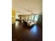 Bright and spacious living room with hardwood floors and kitchen access at 2539 Early Light Dr, Las Vegas, NV 89142
