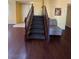 Carpeted staircase with wooden banister, leading to the second floor at 2539 Early Light Dr, Las Vegas, NV 89142