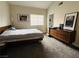 Comfortable bedroom with carpet, natural light, and mid-century modern furnishings at 2925 Wigwam Pkwy # 724, Henderson, NV 89074