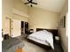 Bright bedroom with high ceilings, ceiling fan, large bed, and a study nook at 2925 Wigwam Pkwy # 724, Henderson, NV 89074