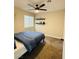 Bedroom featuring ceiling fan, floating shelves, and a window with blinds at 2925 Wigwam Pkwy # 724, Henderson, NV 89074