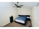 A bedroom featuring a contemporary bed with black nightstands and trim, and a ceiling fan at 2925 Wigwam Pkwy # 724, Henderson, NV 89074