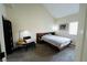 Cozy bedroom featuring carpeted floors, a modern bed frame and minimalist decor at 2925 Wigwam Pkwy # 724, Henderson, NV 89074