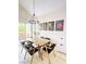 Modern dining room with a stylish table, seating for six, and natural light from the sliding door at 2925 Wigwam Pkwy # 724, Henderson, NV 89074
