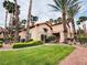 Well-manicured lawn and desert landscaping enhance this exterior elevation at 2925 Wigwam Pkwy # 724, Henderson, NV 89074