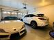 A two-car garage with two modern sports cars at 2925 Wigwam Pkwy # 724, Henderson, NV 89074