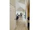 Hallway leading to kitchen and living areas with LVP flooring and high ceilings at 2925 Wigwam Pkwy # 724, Henderson, NV 89074