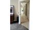 Hallway with neutral paint, LVP floors, artwork, and access to kitchen and bedrooms at 2925 Wigwam Pkwy # 724, Henderson, NV 89074