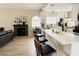Inviting living space flows into an updated kitchen with an island and a cozy fireplace at 2925 Wigwam Pkwy # 724, Henderson, NV 89074