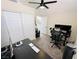 An office featuring a black desk, a computer, an ergonomic chair, and closet storage at 2925 Wigwam Pkwy # 724, Henderson, NV 89074