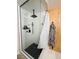 Modern shower with black fixtures, marble-look tile, and a glass enclosure at 2925 Wigwam Pkwy # 724, Henderson, NV 89074