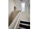 A staircase with carpeted steps and skylight above at 2925 Wigwam Pkwy # 724, Henderson, NV 89074