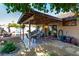 Covered backyard patio with outdoor dining and entertainment area at 3138 Valleywood Rd, Henderson, NV 89014