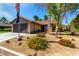 Charming single-story home featuring stone accents, a two-car garage, and low-maintenance desert landscaping at 3138 Valleywood Rd, Henderson, NV 89014