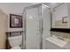 Bathroom featuring a glass door shower, updated vanity, decorative mirror, and modern fixtures at 3266 Mountain Spring Rd, Las Vegas, NV 89146