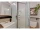 Bathroom featuring a glass door shower, updated vanity, decorative mirror, and modern fixtures at 3266 Mountain Spring Rd, Las Vegas, NV 89146
