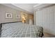 View of the bedroom featuring neutral wall color, a bed with patterned bedding, and a closet at 3266 Mountain Spring Rd, Las Vegas, NV 89146