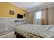 Cozy bedroom featuring modern decor, a flat-screen TV, and a comfortable bed with patterned bedding at 3266 Mountain Spring Rd, Las Vegas, NV 89146