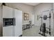 Bonus room with tiled floors, a work out station, and a vintage refrigerator at 3266 Mountain Spring Rd, Las Vegas, NV 89146