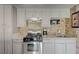 Functional kitchen boasting stainless steel oven, range, ample cabinet space, and lovely granite countertops at 3266 Mountain Spring Rd, Las Vegas, NV 89146
