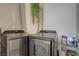 A well-equipped laundry area with side by side, large capacity washing machine and dryer at 3266 Mountain Spring Rd, Las Vegas, NV 89146