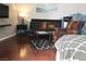 Comfortable living room featuring wood floors, a colorful chair, and contemporary décor at 3266 Mountain Spring Rd, Las Vegas, NV 89146