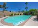 Sparkling pool surrounded by lush landscaping and palm trees, creating a backyard oasis at 3266 Mountain Spring Rd, Las Vegas, NV 89146