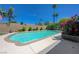 Backyard pool surrounded by lush landscaping and mature palm trees, perfect for outdoor relaxation at 3266 Mountain Spring Rd, Las Vegas, NV 89146